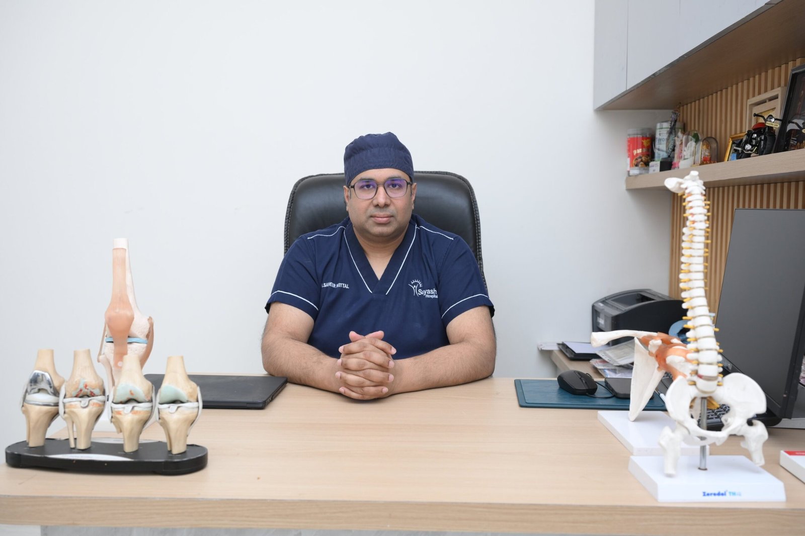 Dr. Sameer Mittal consulting a patient in the OPD consultation room at Suyash Hospital, Raipur
